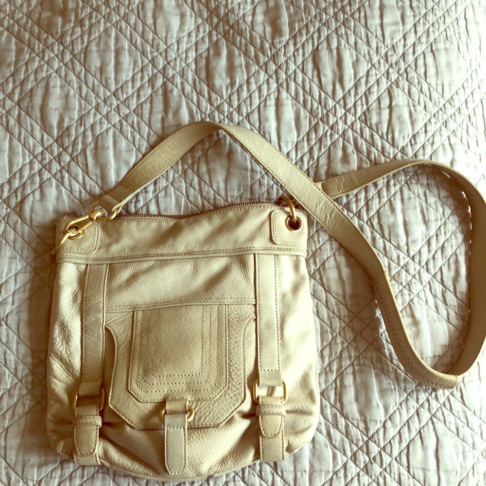The sak crossbody, cream leather purse